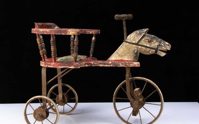 A carved and painted wooden horse tricycle circa 1900