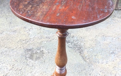 A circular Victorian mahogany occasional table supported on baluster turned...
