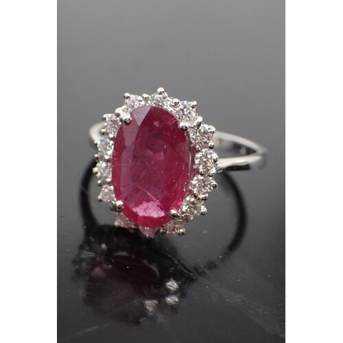 A diamond and ruby cluster ring, total estimated weight of r...