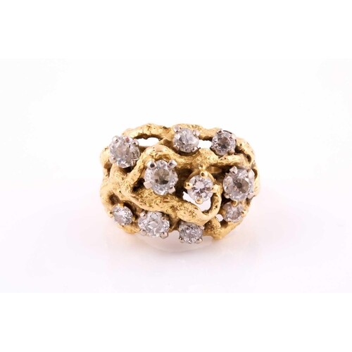 A diamond cocktail ring set in yellow metal, featuring old-c...