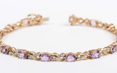 A gold, amethyst and diamond bracelet, claw set with a row of oval cut amethysts alternating with pa