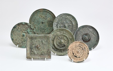A group of seven Chinese bronze mirrors