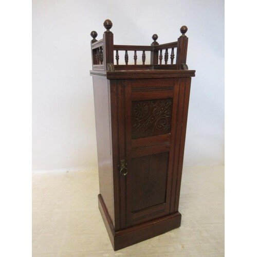 A late Victorian mahogany gallery top bedside locker. Overal...