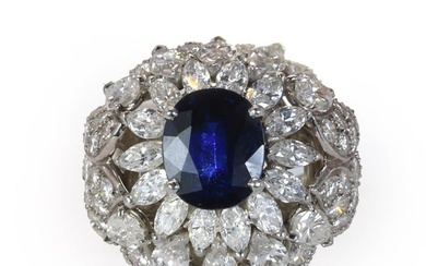 A mid 20th century sapphire and diamond bombé ring
