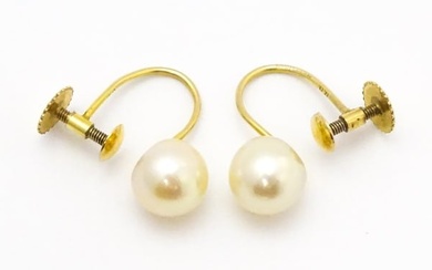 A pair of 9ct gold screw back earrings set with pearls Please Note - we do not make reference to