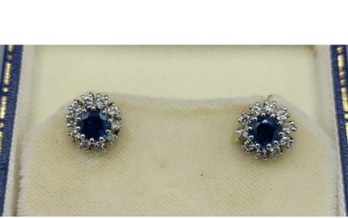 A pair of 9ct white gold Diamond and Sapphire cluster ear st...