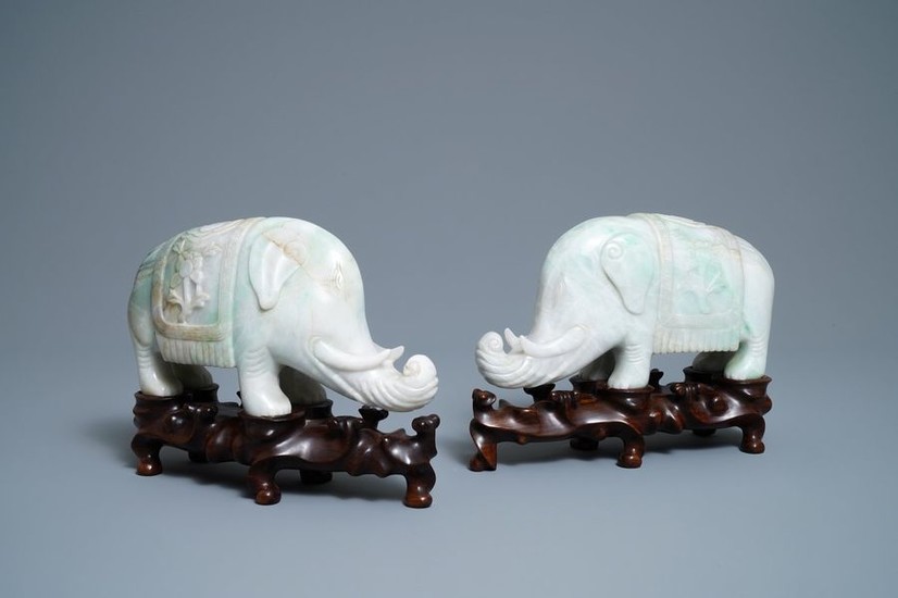 A pair of Chinese jadeite models of elephants,...
