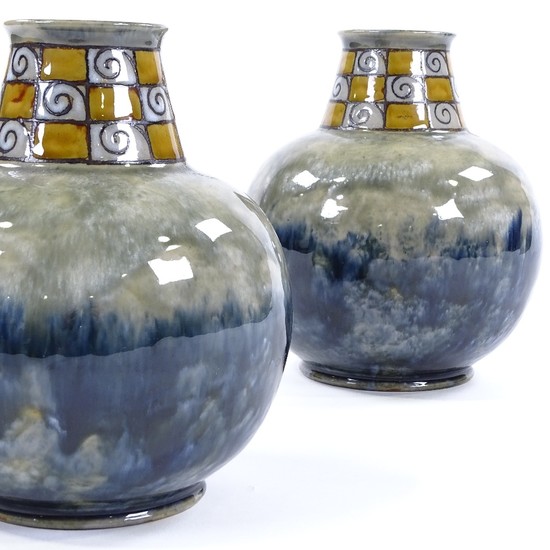 A pair of Royal Doulton squat vases, mottled blue glaze with...