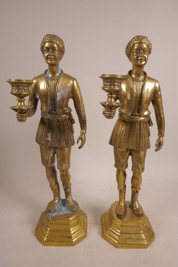 A pair of brass candlesticks in the form of Moors, 14" x 4",...