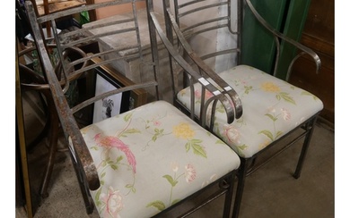 A pair of cast iron garden chairs