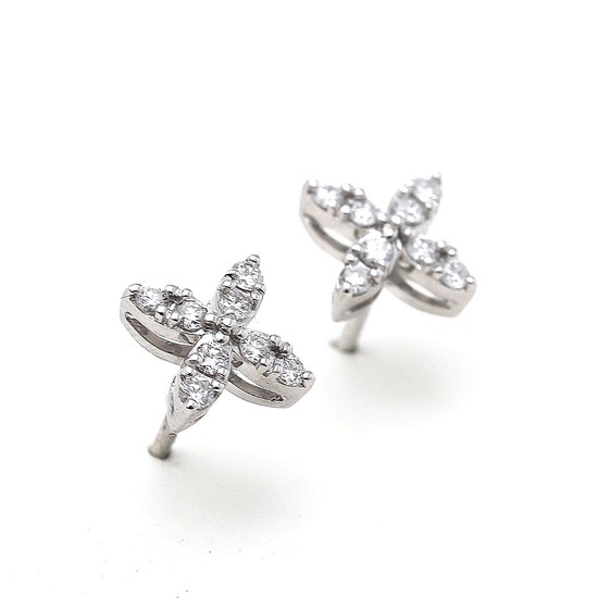 A pair of ear studs each set with numerous brilliant-cut diamonds, mounted on 18k white gold. (2)