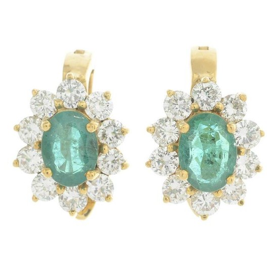 A pair of emerald and diamond cluster earrings. Emerald