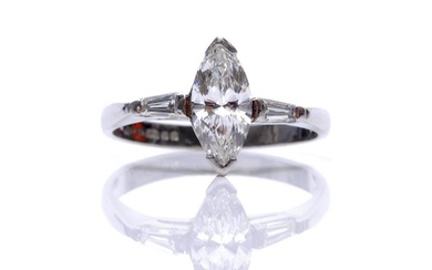 A platinum diamond solitaire ring, marquise claw set stone, ...