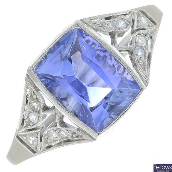 A rectangular-shape sapphire and brilliant-cut diamond dress ring.