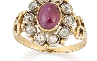 A ruby and diamond cluster ring, the oval cabochon ruby...