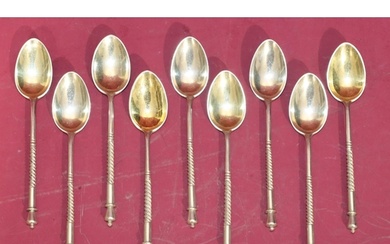A set of 9 Russian silver teaspoons with twist handles, engr...