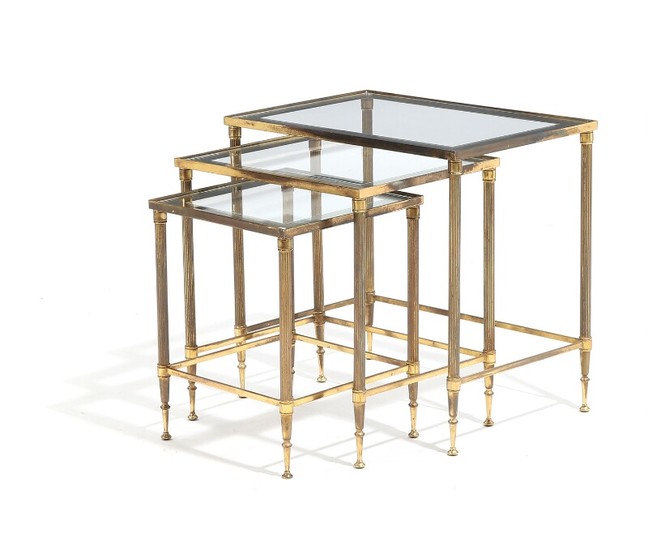 A set of three French 20th century brass nesting tables, glass tops with mirror edges. H. 49. L. 51. W. 35 cm. (3)