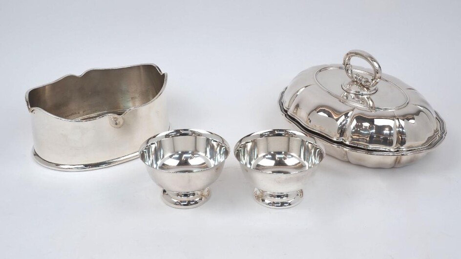 A shaped oval entrée dish, the base stamped Jezler 800, the lid unmarked, assumed silver, designed with fluted sides and reeded rim, the lid with fixed loop handle, 29.6cm long, together with a shaped oval silver plated dish and two silver plated...