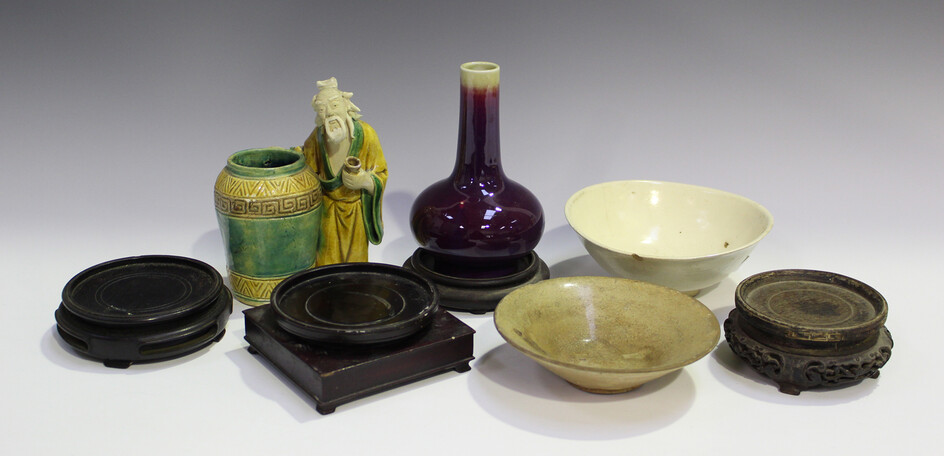 A small group of Chinese pottery, including a flambé glazed bottle vase, height 15cm, a sancai