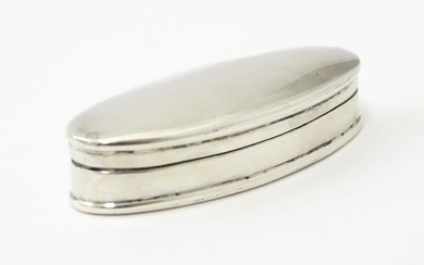 A small silver / white metal box of oval form 2" wide Please Note - we do not make reference to the