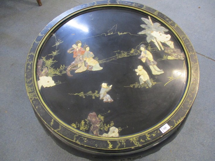 A vintage black painted Chinese carved soapstone and gilt co...
