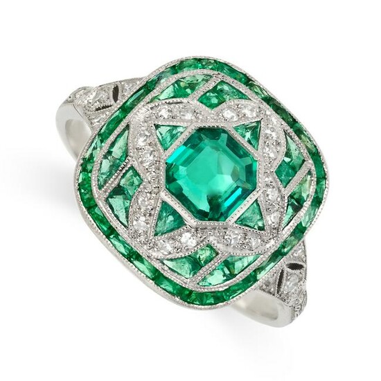 AN EMERALD AND DIAMOND DRESS RING set with an step cut