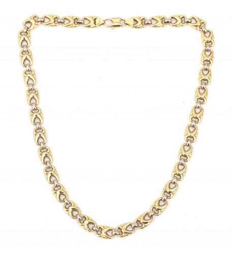An 18 karat gold two tone necklace. Composed of flat links with a cut out geometrical motif. Gross weight: 27 g.