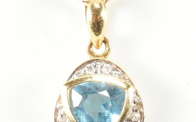 An 18ct gold, topaz and diamond pendant necklace. The pendan...