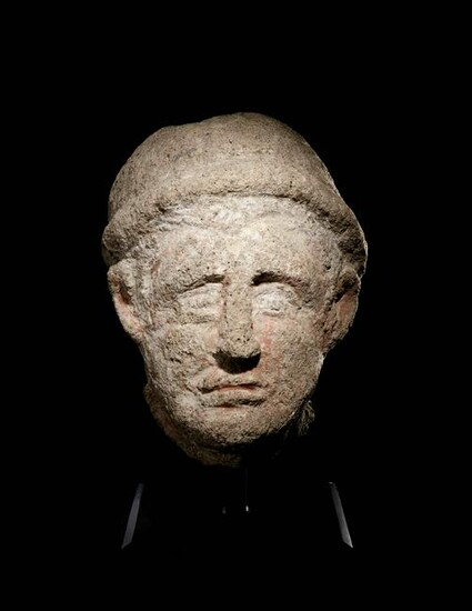 An Etruscan Over-Lifesized Nenfro Portrait Head of a