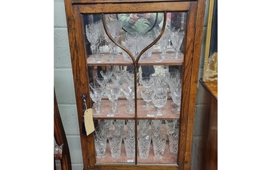 An early 20th Century Oak single door Display Cabinet with p...