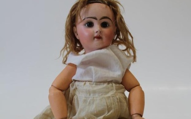 An early 20th century French Jumeau-type bisque head doll. Head...