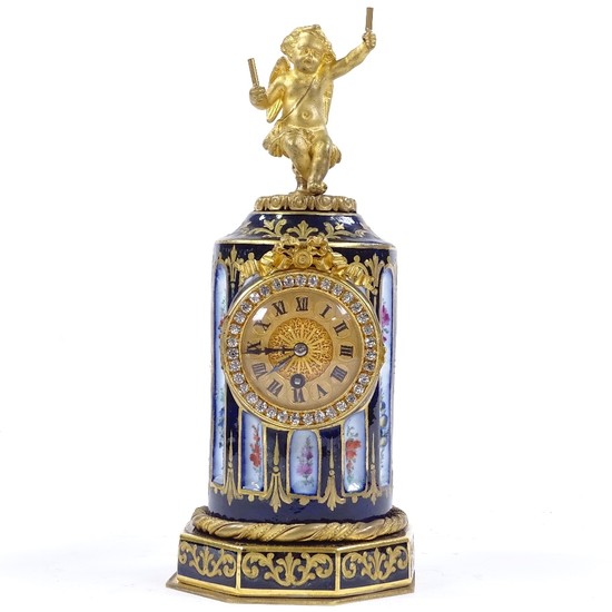 An ornate 19th century French porcelain-cased table clock, t...