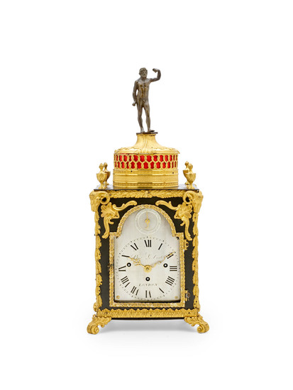 An unusual gilt and patinated bronze small four tune musical table clock