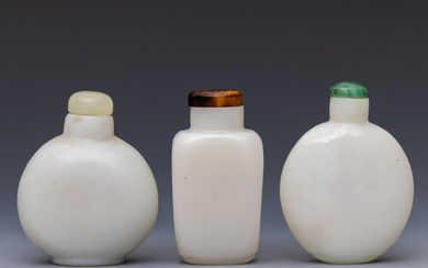 China, three opaque white glass snuff bottles and stoppers, 19th century