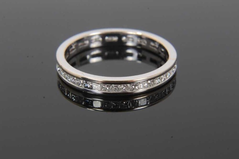 Diamond full band eternity ring with a full band of princess cut diamonds in 18ct white gold channel setting. Estimated total diamond weight approximately 0.50cts. Hallmarked 18ct. Ring size L.