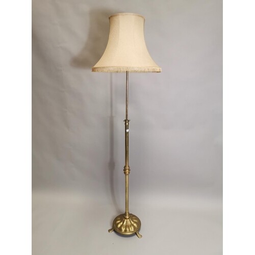 Edwardian brass standard lamp with shade raised on adjustabl...