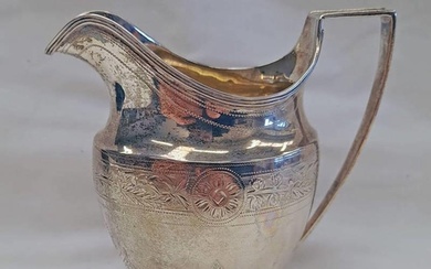 GEORGE III SILVER CREAM JUG ENGRAVED WITH FLORAL SWAGS BY AL...