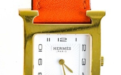 HERMES PARIS - Montre de dame “Heure H” en acier doré - Cadran rayonnant carré...