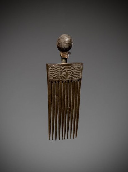 LWENA, Angola. Old comb topped by a finely...