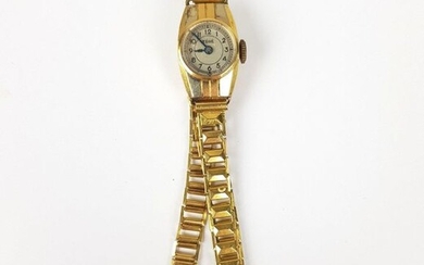 Ladies' WATCH in 750 gold ‰, curved case, cream dial, Arabic numerals, mechanical movement (to be revised), PB 13 g