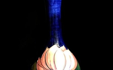 MOORCROFT. Fine earthenware bottle vase with full polychrome floral decoration...
