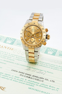 Rolex. A Yellow Gold and Stainless Steel Chronograph Bracelet watch with Diamond indexes