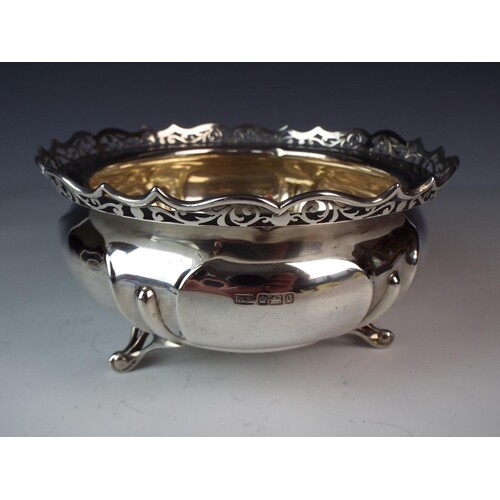 Solid Silver footed bowl with pierced edgs on three scrolled...