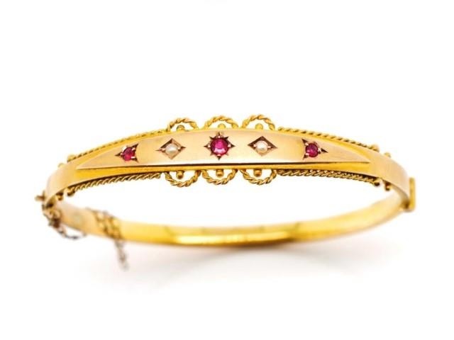 Victorian 9ct yellow gold bangle set with seed pearls and ga...