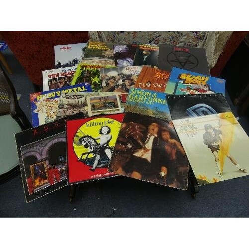 Vinyl Records; A collection of mostly original Rock LP's, in...