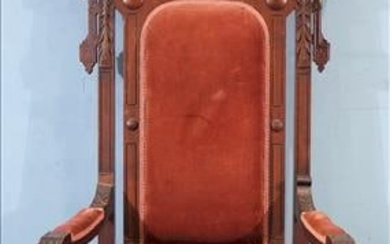 Walnut Victorian high back cathedral chair with carved crown