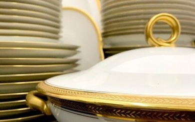 White porcelain dinner service with gold edging comprising: 24 dinner...
