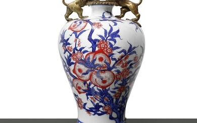 White porcelain vase with blue and pink peach decorations, bronze lion decorations, 19th century Qiang Long Nian Zhi