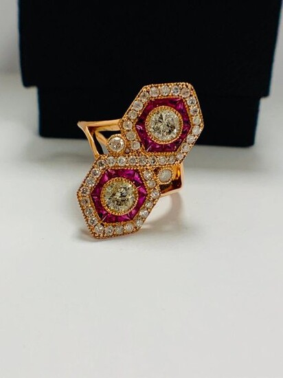 14ct Rose Gold Ruby and Diamond ring featuring centre, 2 round brilliant cut Diamonds (0.67ct), bezel set, with 24 free from cut, Natural Rubies (0.72ct TDW), channel set, and 43 round brilliant cut Diamonds (0.52ct TDW), pave set.