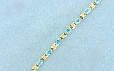 14ct TW Swiss Blue Topaz and Diamond Line Bracelet in 14K Yellow Gold